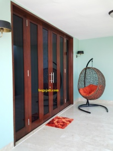 Pintu Kaca Lipat Kayu Merbau Oven